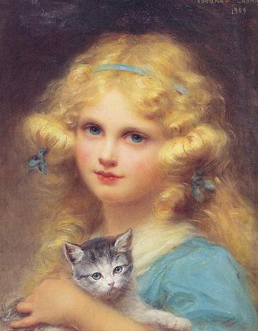 Portrait of a young girl holding a kitten